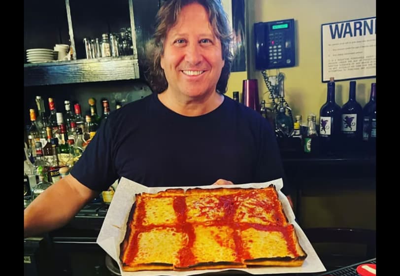 Tony Lazzara with his famous pizza